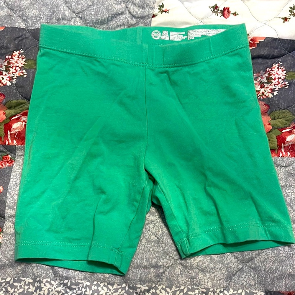 Green biker shorts.